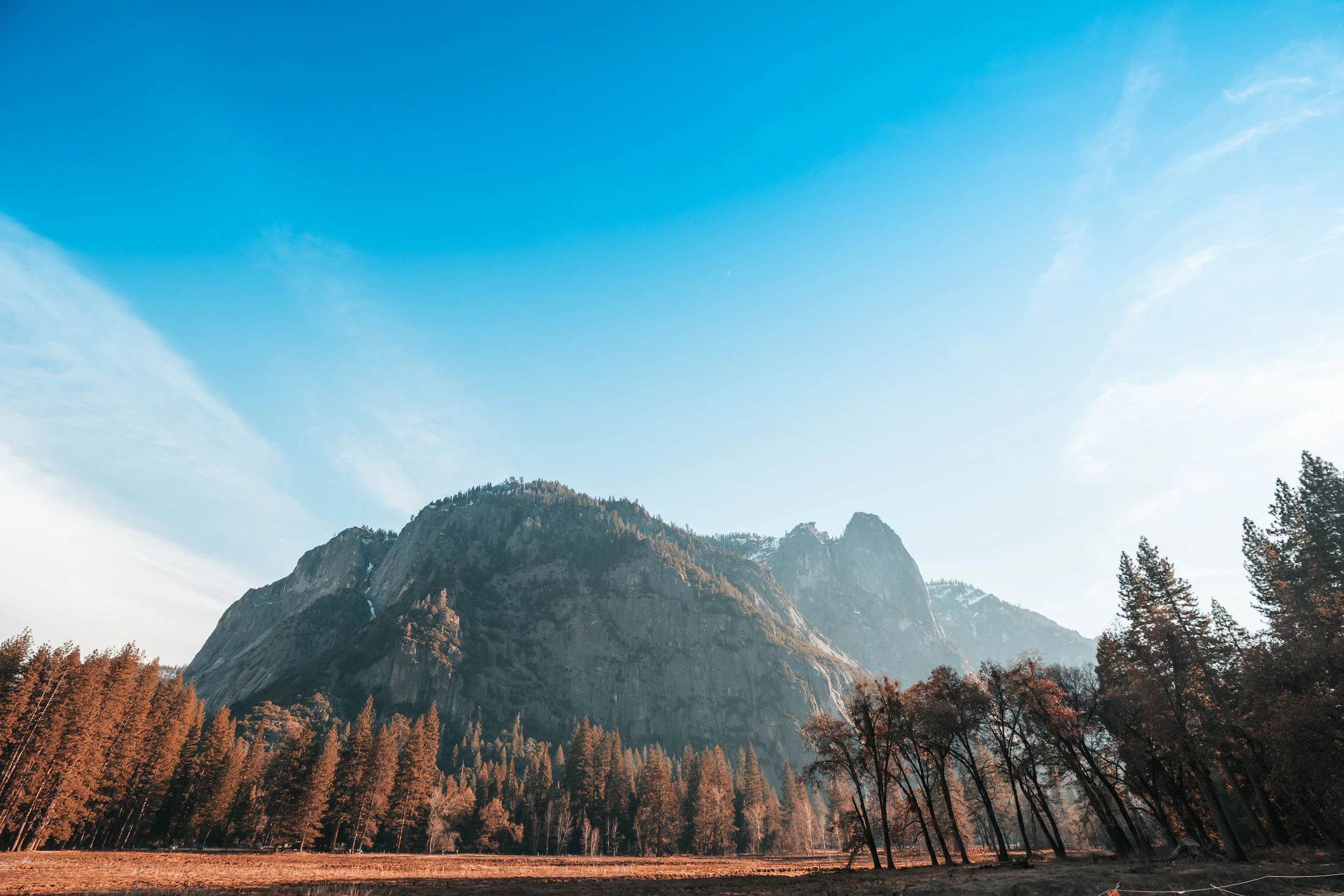Granite cliffs and autumn trees in Yosemite National Park, California